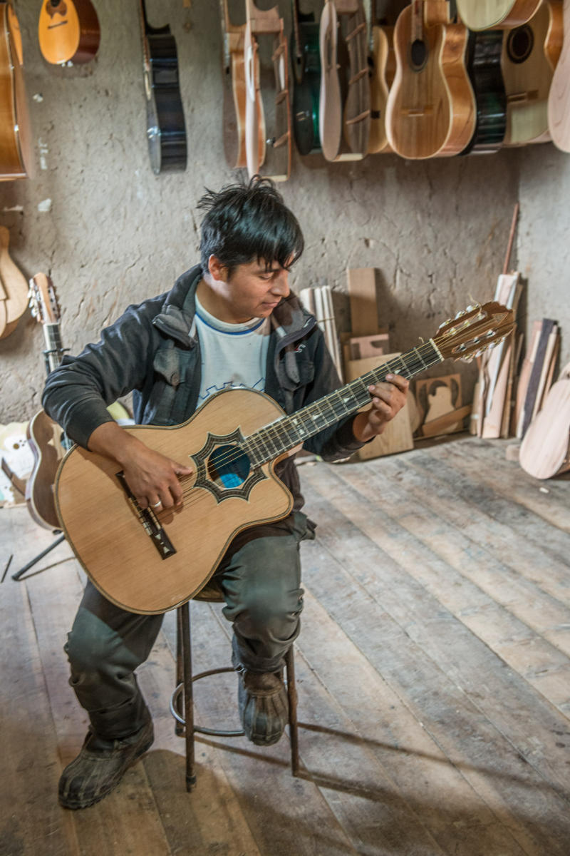 Guitar craftsman near Cuenca , Ecuador