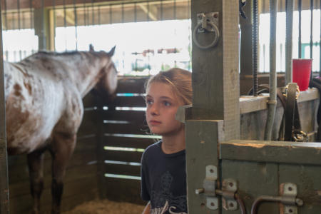 Young girl in Stable with horse  Dutchess County Fair
